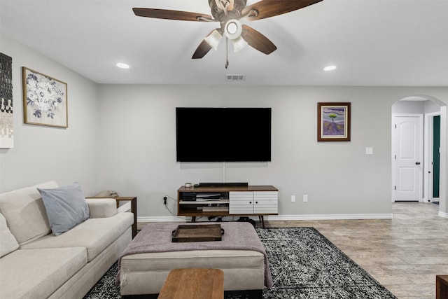 2104 Shane Ave, Fort Worth, TX 76134 - living area with arched walkways, baseboards, ceiling fan, and recessed lighting