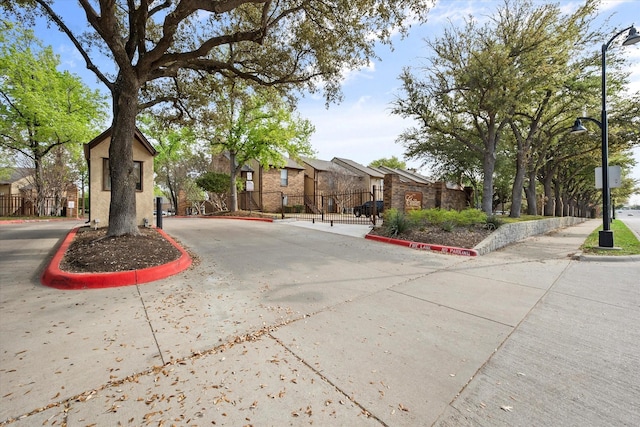 1204 Calico Ln Unit 720, Arlington, TX 76011 - view of front facade with a gate and a residential view