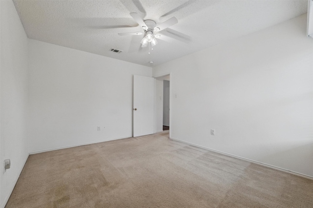 218 Whispering Dell Ln, Weatherford, TX 76085 - empty room with light colored carpet, a ceiling fan, and a textured ceiling