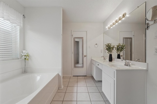 218 Whispering Dell Ln, Weatherford, TX 76085 - full bath with tile patterned flooring, a garden tub, double vanity, and a textured ceiling