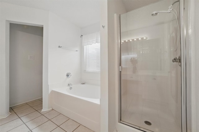 218 Whispering Dell Ln, Weatherford, TX 76085 - full bathroom with a shower stall, tile patterned flooring, a garden tub, and baseboards