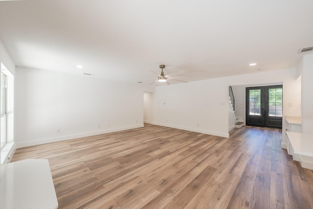 2815 Perkins Rd, Arlington, TX 76016 - unfurnished living room with light wood-type flooring, a ceiling fan, recessed lighting, and baseboards