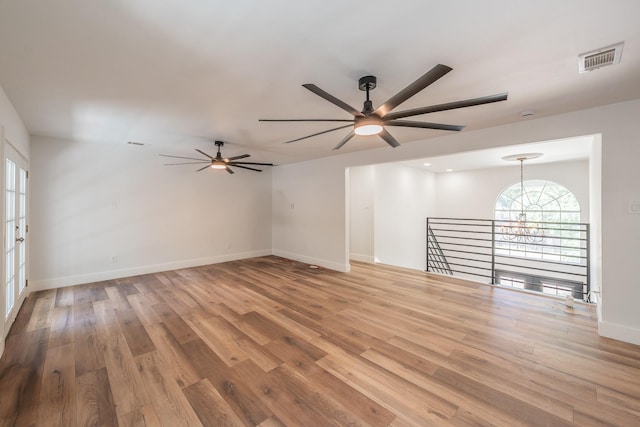 2815 Perkins Rd, Arlington, TX 76016 - unfurnished room featuring ceiling fan, light wood-style floors, and baseboards