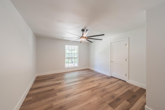2815 Perkins Rd, Arlington, TX 76016 - unfurnished room featuring light wood finished floors, a ceiling fan, and baseboards