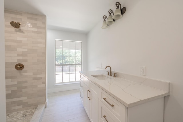 2815 Perkins Rd, Arlington, TX 76016 - full bathroom with tiled shower, vanity, and tile patterned flooring