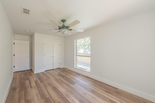 2815 Perkins Rd, Arlington, TX 76016 - unfurnished bedroom with baseboards, light wood-type flooring, a closet, and a ceiling fan