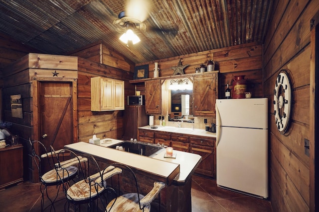 6305 Barrel Spring Rd, Nocona, TX 76255 - kitchen featuring freestanding refrigerator, wooden walls, a ceiling fan, vaulted ceiling, and wood ceiling