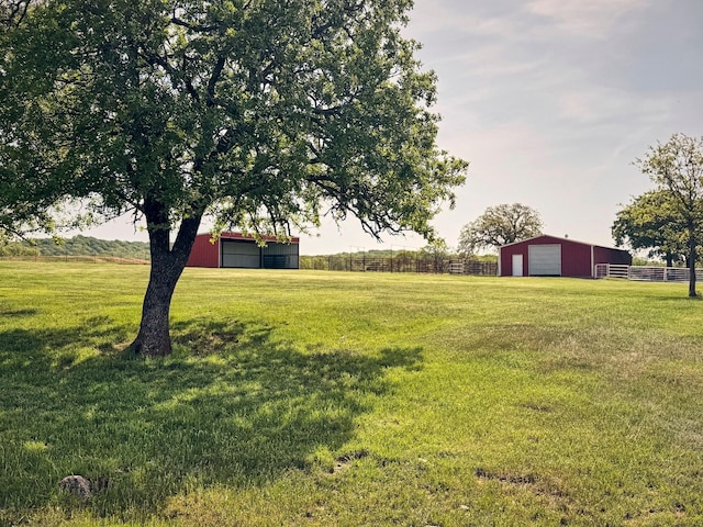 6305 Barrel Spring Rd, Nocona, TX 76255 - view of yard featuring an outbuilding, a garage, and an outdoor structure