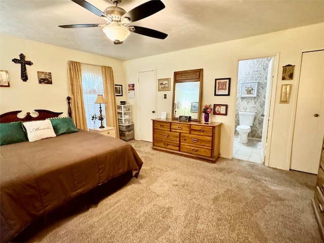 7302 Hardwood Trl, Dallas, TX 75249 - bedroom with light colored carpet, ensuite bath, and ceiling fan