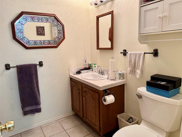 7302 Hardwood Trl, Dallas, TX 75249 - half bath featuring tile patterned flooring, toilet, and vanity
