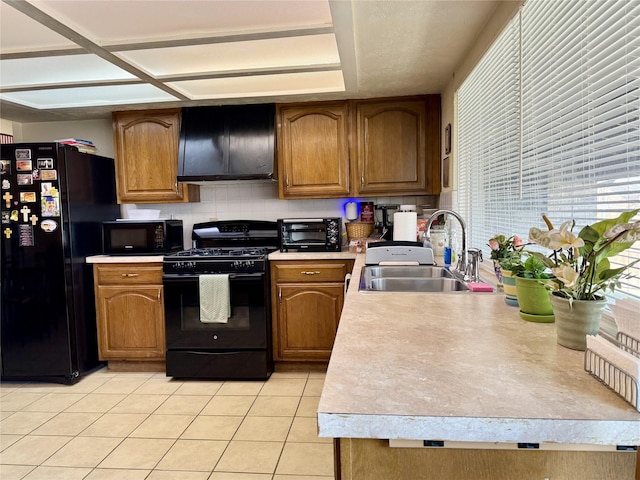7302 Hardwood Trl, Dallas, TX 75249 - kitchen with black appliances, a sink, extractor fan, light tile patterned flooring, and light countertops