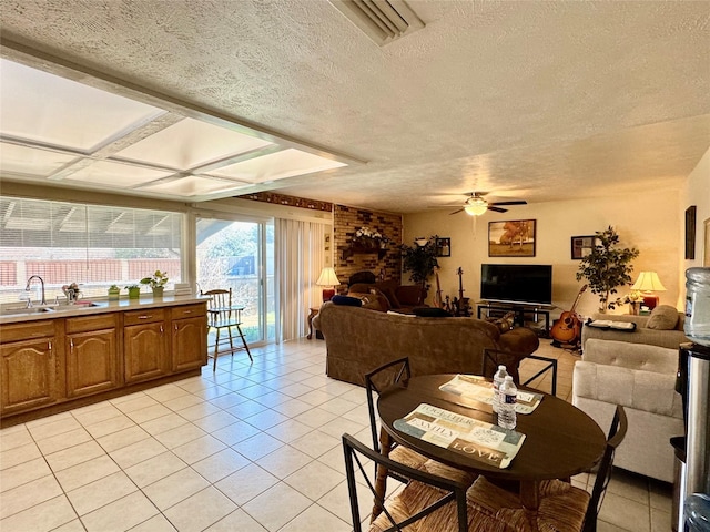 7302 Hardwood Trl, Dallas, TX 75249 - dining area featuring light tile patterned floors, a textured ceiling, and ceiling fan