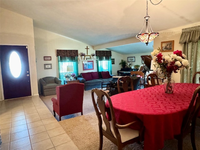 7302 Hardwood Trl, Dallas, TX 75249 - dining space with vaulted ceiling and tile patterned flooring