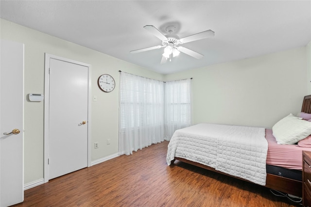 895 Dublin Dr Unit D, Richardson, TX 75080 - bedroom with wood finished floors, baseboards, and a ceiling fan