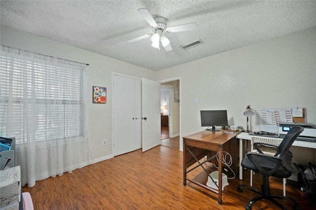 895 Dublin Dr Unit D, Richardson, TX 75080 - office space featuring wood finished floors, a ceiling fan, a textured ceiling, and baseboards