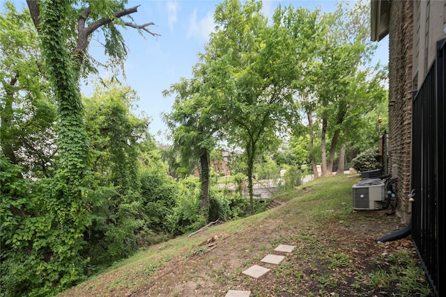 895 Dublin Dr Unit D, Richardson, TX 75080 - view of yard featuring central air condition unit