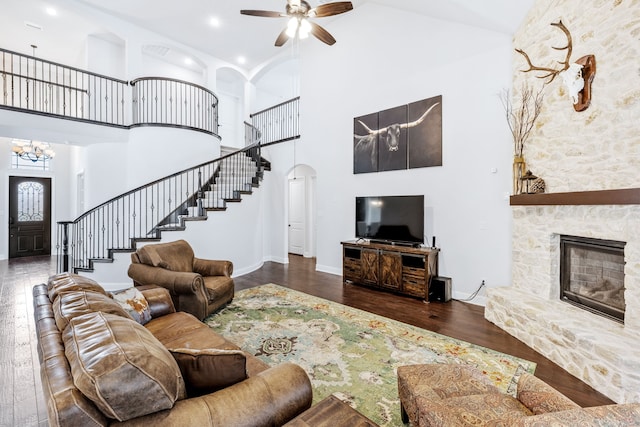 206 Stallion Ln, Hickory Creek, TX 75065 - living area with hardwood / wood-style flooring, stairs, high vaulted ceiling, ceiling fan, and arched walkways
