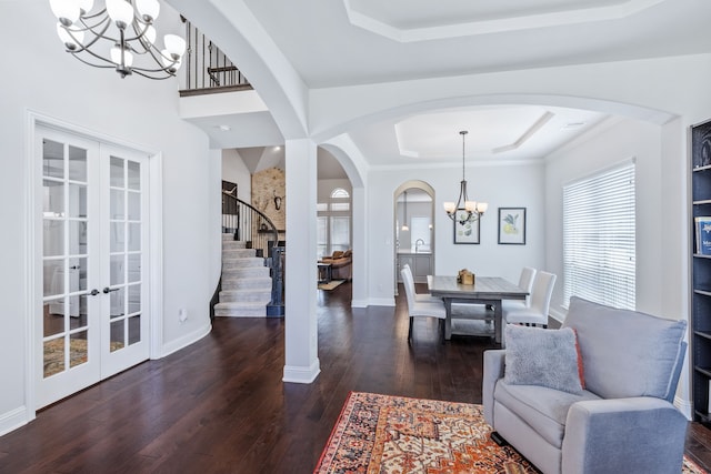 206 Stallion Ln, Hickory Creek, TX 75065 - foyer featuring a tray ceiling, a chandelier, arched walkways, and stairway