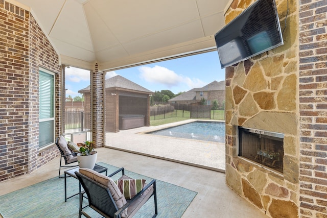 206 Stallion Ln, Hickory Creek, TX 75065 - view of patio / terrace featuring a fenced backyard, an outdoor stone fireplace, and a jacuzzi