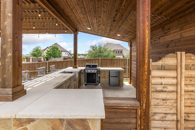 206 Stallion Ln, Hickory Creek, TX 75065 - view of patio featuring area for grilling, fence, and a grill