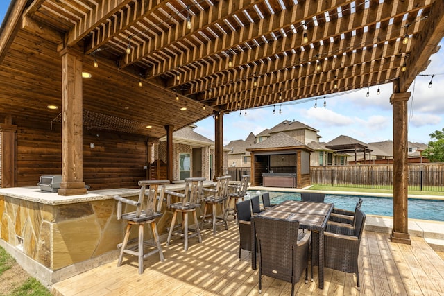 206 Stallion Ln, Hickory Creek, TX 75065 - view of patio with a hot tub, a fenced backyard, outdoor dining area, and a pergola