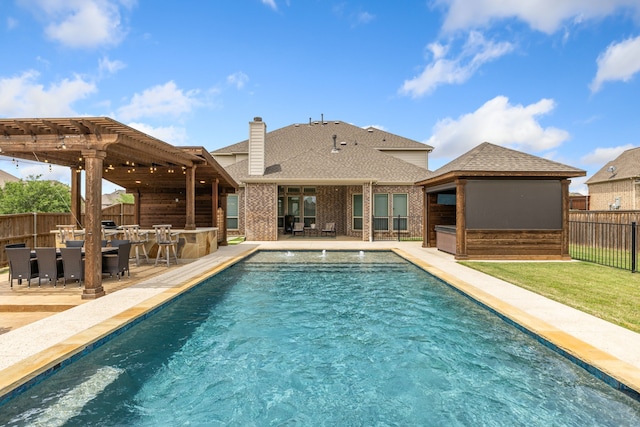 206 Stallion Ln, Hickory Creek, TX 75065 - view of swimming pool featuring fence, a pergola, and a patio