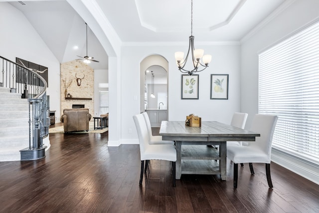 206 Stallion Ln, Hickory Creek, TX 75065 - dining space featuring healthy amount of natural light, a ceiling fan, arched walkways, and a chandelier