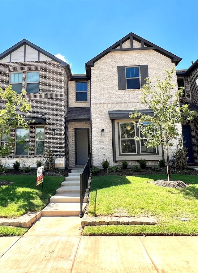 2933 Tenor Way, Sachse, TX 75048 - view of front of property with a front yard and brick siding