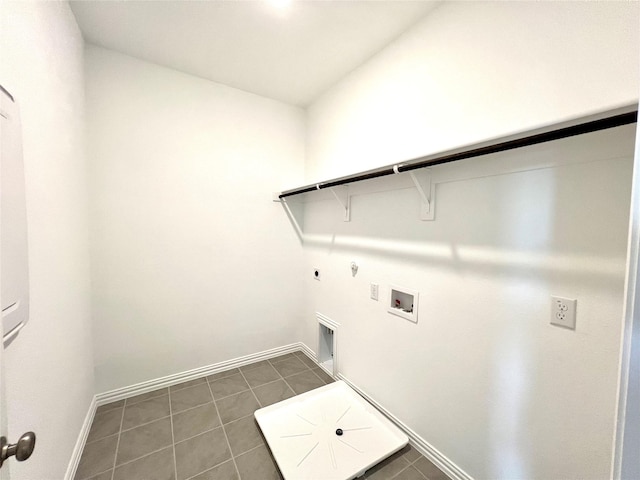 2933 Tenor Way, Sachse, TX 75048 - laundry area with hookup for a gas dryer, hookup for an electric dryer, washer hookup, baseboards, and dark tile patterned flooring