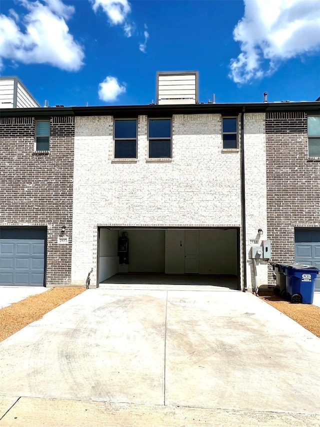 2933 Tenor Way, Sachse, TX 75048 - view of property exterior featuring a garage, driveway, and brick siding