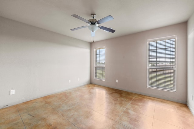 300 Morris St, Riesel, TX 76682 - spare room with light tile patterned flooring, baseboards, and a ceiling fan