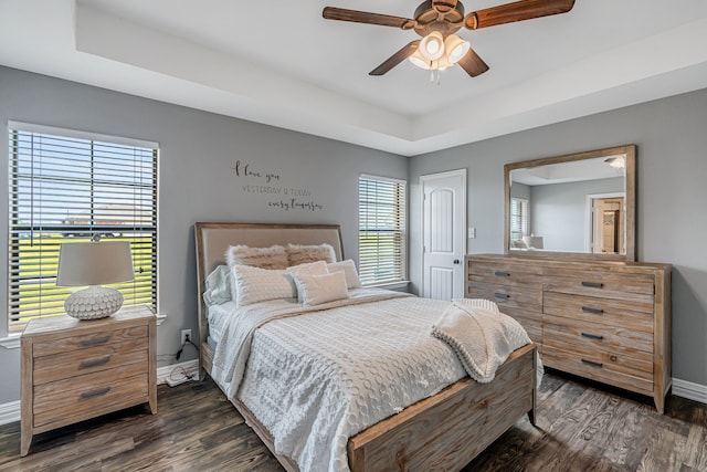 160 Grays Creek Cir, Alma, TX 75119 - bedroom featuring baseboards, dark wood finished floors, a raised ceiling, and a ceiling fan