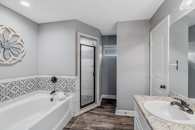 160 Grays Creek Cir, Alma, TX 75119 - full bathroom with a garden tub, vanity, wood finished floors, a shower stall, and baseboards
