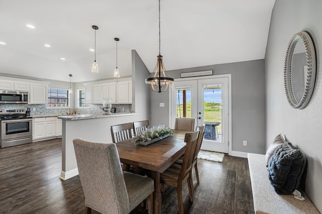 160 Grays Creek Cir, Alma, TX 75119 - dining space featuring lofted ceiling, plenty of natural light, dark wood finished floors, french doors, and baseboards