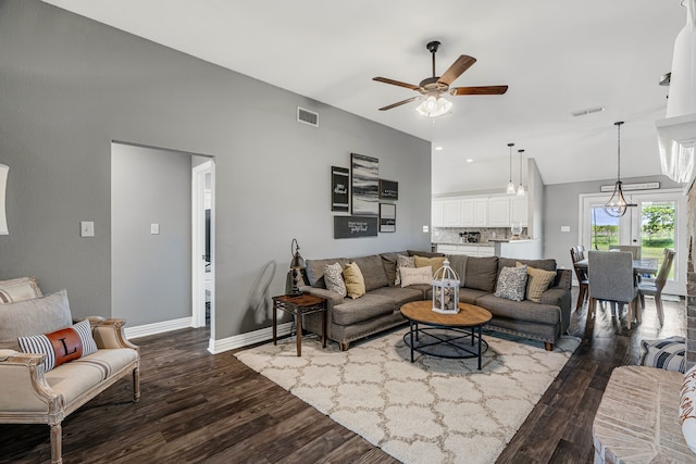 160 Grays Creek Cir, Alma, TX 75119 - living room featuring dark wood-style floors, a ceiling fan, baseboards, and vaulted ceiling