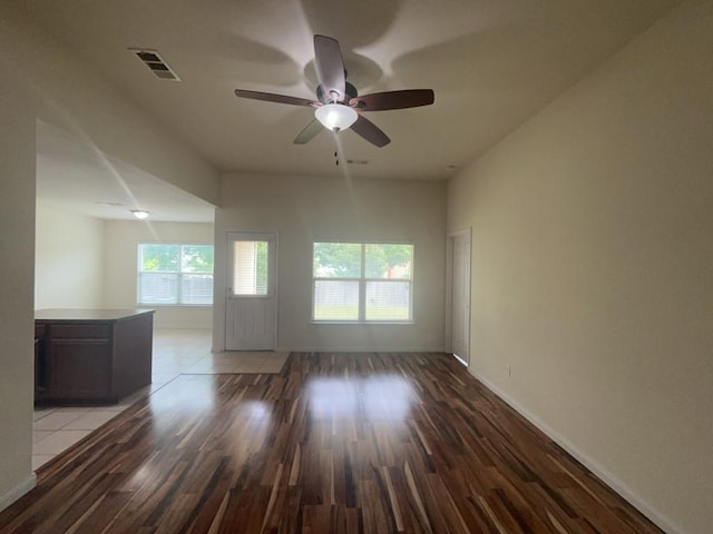 10009 Iron Ridge Dr, Fort Worth, TX 76140 - spare room with light wood-style flooring, a ceiling fan, and baseboards
