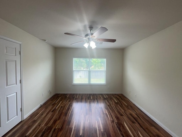 10009 Iron Ridge Dr, Fort Worth, TX 76140 - unfurnished room featuring ceiling fan, dark wood finished floors, and baseboards
