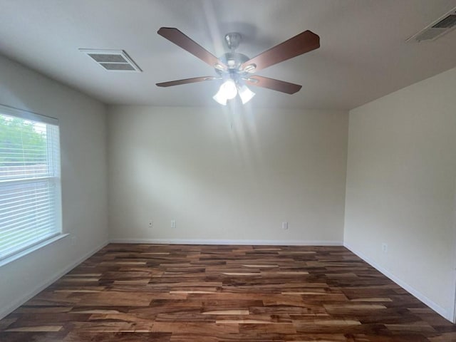 10009 Iron Ridge Dr, Fort Worth, TX 76140 - empty room with wood finished floors, a ceiling fan, and baseboards