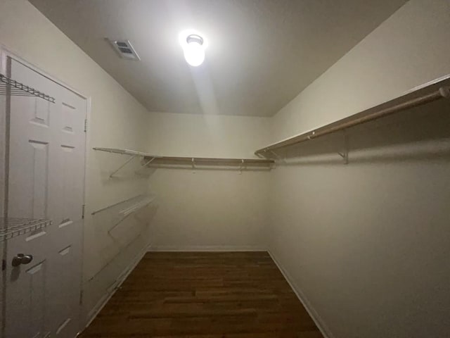 10009 Iron Ridge Dr, Fort Worth, TX 76140 - walk in closet with dark wood-style floors