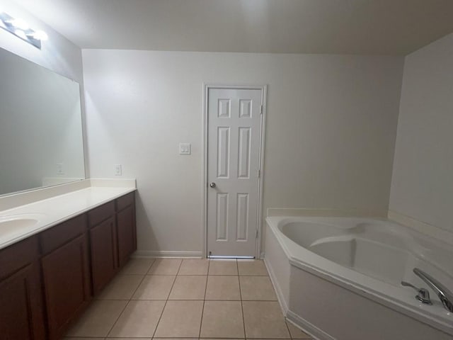 10009 Iron Ridge Dr, Fort Worth, TX 76140 - bathroom with tile patterned flooring, a garden tub, and vanity