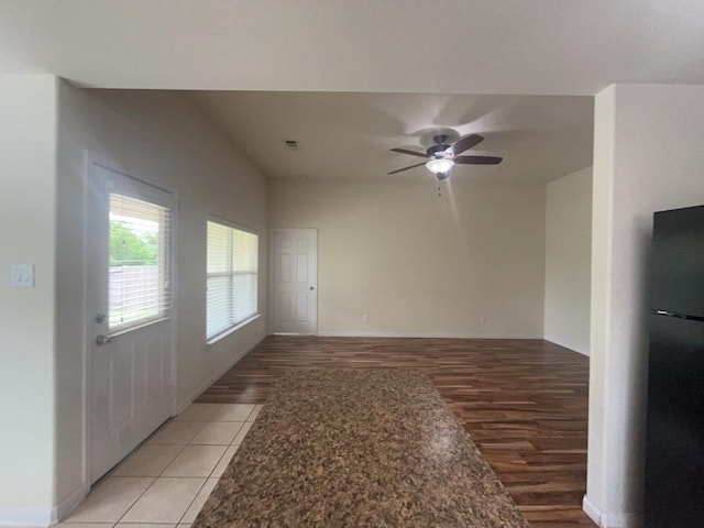10009 Iron Ridge Dr, Fort Worth, TX 76140 - unfurnished room featuring light wood finished floors, ceiling fan, and baseboards