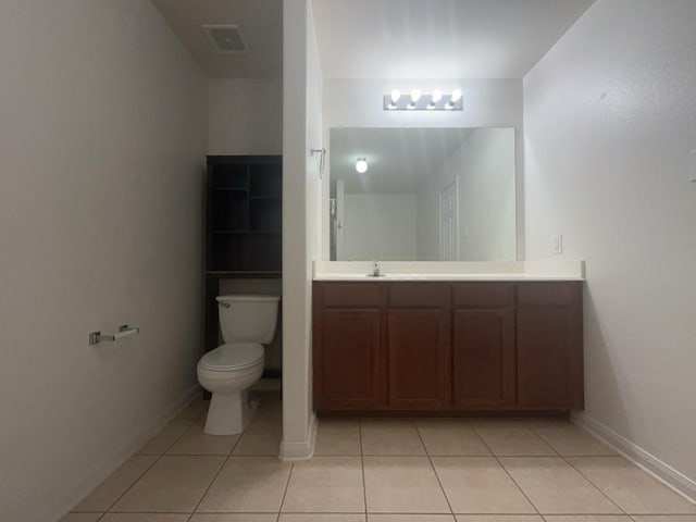 10009 Iron Ridge Dr, Fort Worth, TX 76140 - bathroom featuring tile patterned floors, toilet, vanity, and baseboards