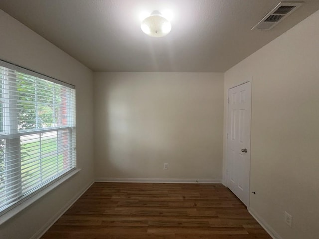 10009 Iron Ridge Dr, Fort Worth, TX 76140 - empty room featuring wood finished floors, healthy amount of natural light, and baseboards