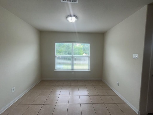 10009 Iron Ridge Dr, Fort Worth, TX 76140 - spare room featuring light tile patterned floors and baseboards