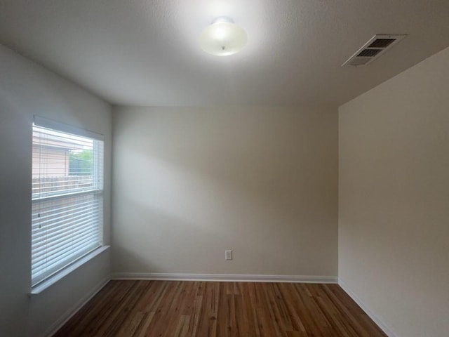 10009 Iron Ridge Dr, Fort Worth, TX 76140 - spare room with wood finished floors and baseboards
