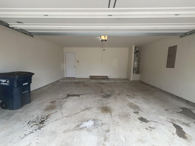 10009 Iron Ridge Dr, Fort Worth, TX 76140 - garage with electric panel, water heater, and a garage door opener