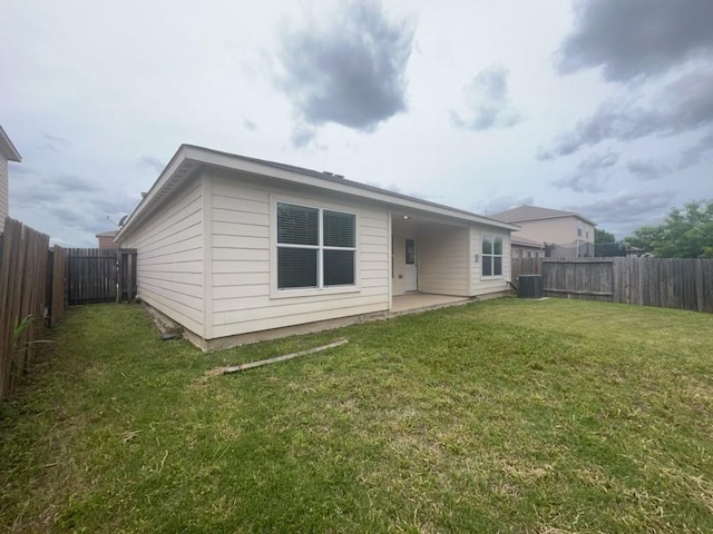 10009 Iron Ridge Dr, Fort Worth, TX 76140 - back of property with cooling unit and a patio