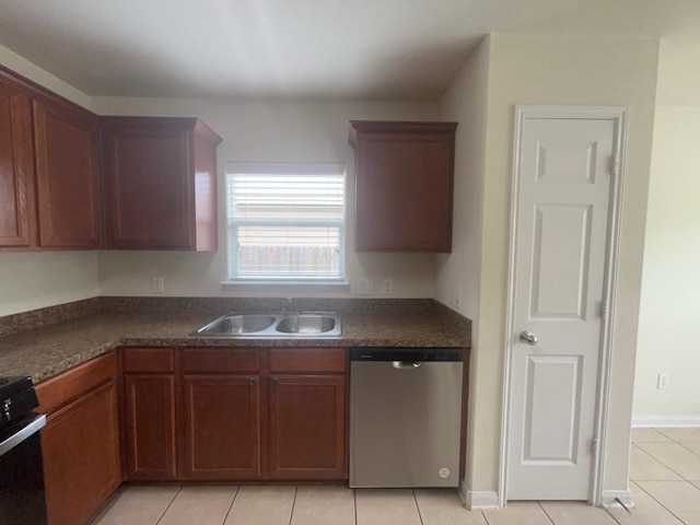 10009 Iron Ridge Dr, Fort Worth, TX 76140 - kitchen with stainless steel dishwasher, a sink, dark countertops, light tile patterned flooring, and range with gas stovetop