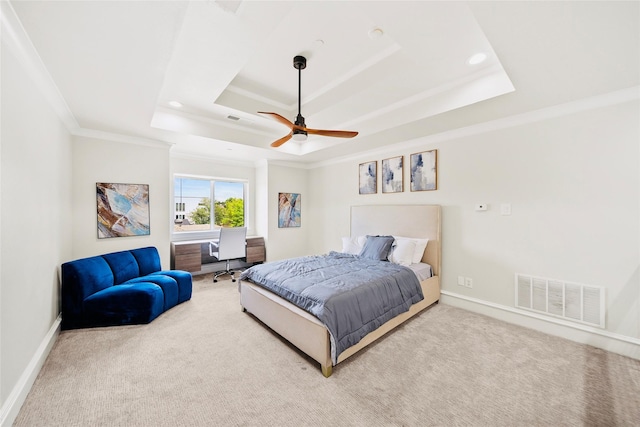 bedroom with a raised ceiling, crown molding, carpet, baseboards, and a ceiling fan
