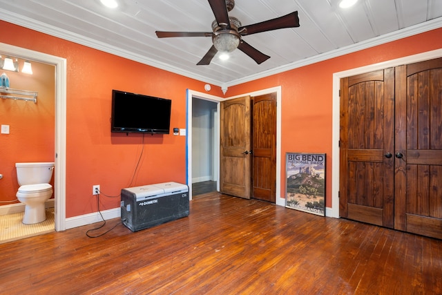 bedroom with hardwood / wood-style floors, ornamental molding, baseboards, ensuite bathroom, and ceiling fan